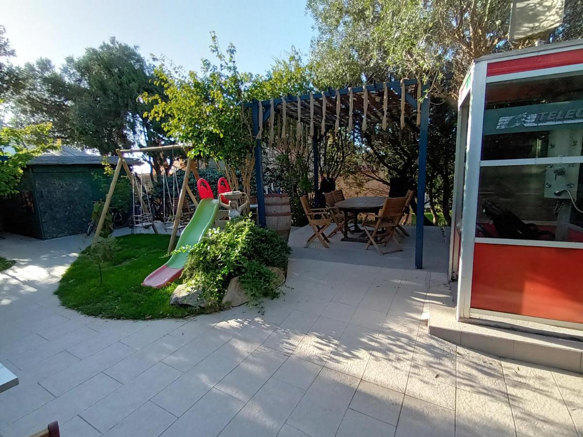 Portopollo Surfhouse Barrabisa Eksteriør bilde